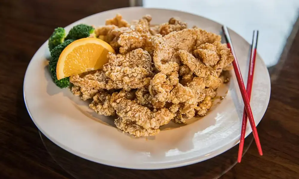 Crispy fried chicken tossed in sweet and tangy orange sauce, a savory delight at Imperial Dynasty, a Chinese Restaurant in Cranston